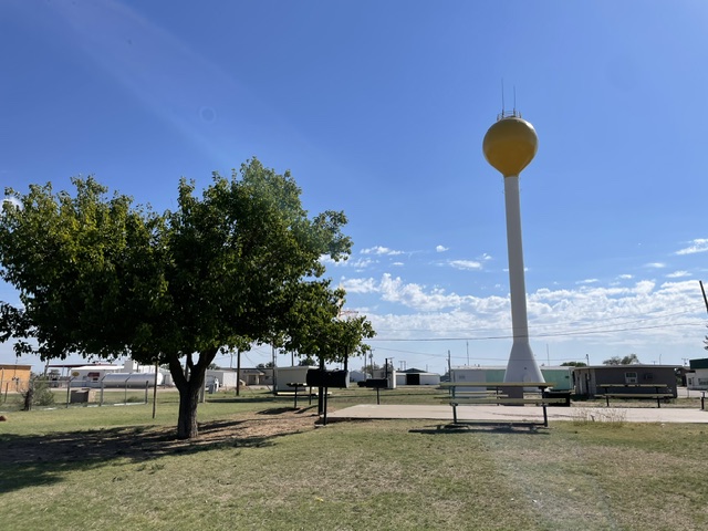 Basketball half court, seating and grill at Tooter Reed Park in Kress, TX